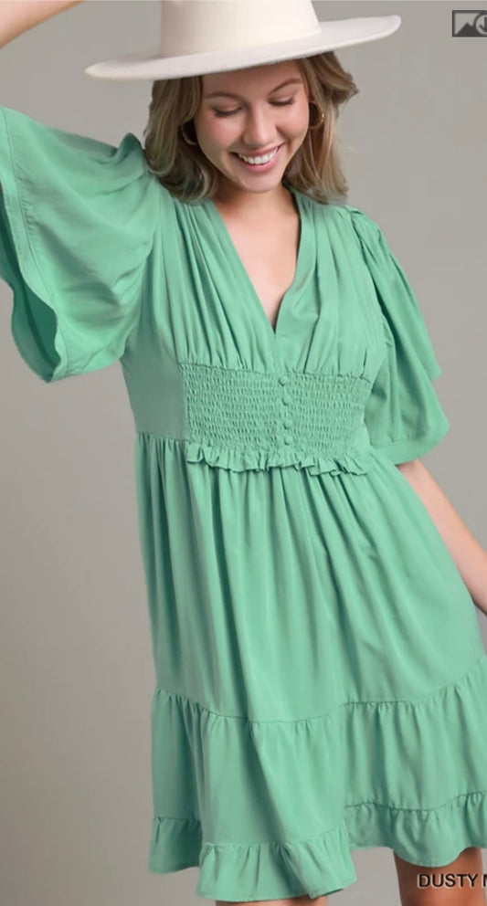 R0274 Short-sleeved Tiered Dress featuring a Deep V-Neck and Smocked Waist.